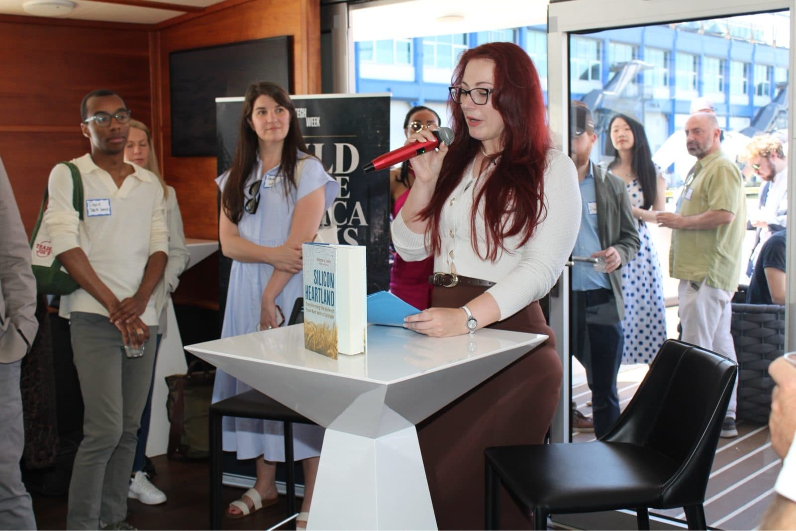 A speaker addresses guests aboard the yacht at Heartland Venture Summit